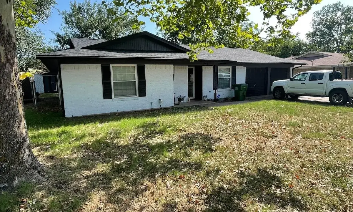 Professional roofing crew working on a residential roof in Vacaville